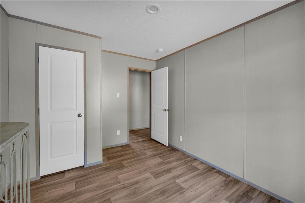 946 Essic Road Ball Ground, GA 30107 - Photo 26 of 45 a view of hallway with wooden floor