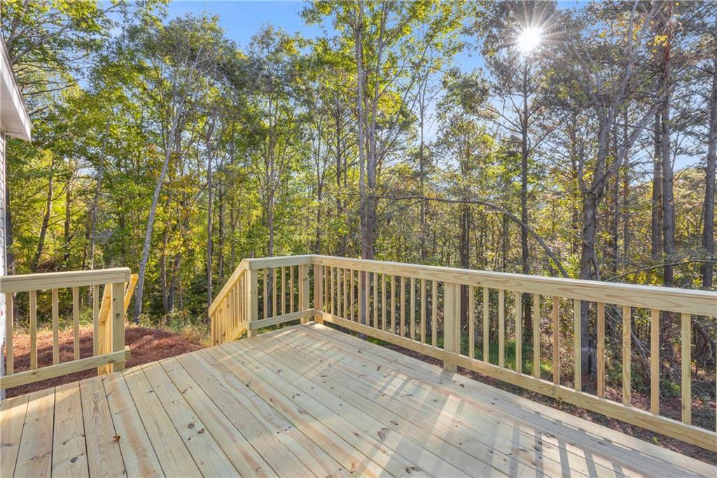 946 Essic Road Ball Ground, GA 30107 - Photo 34 of 45 a view of balcony with deck and wooden floor
