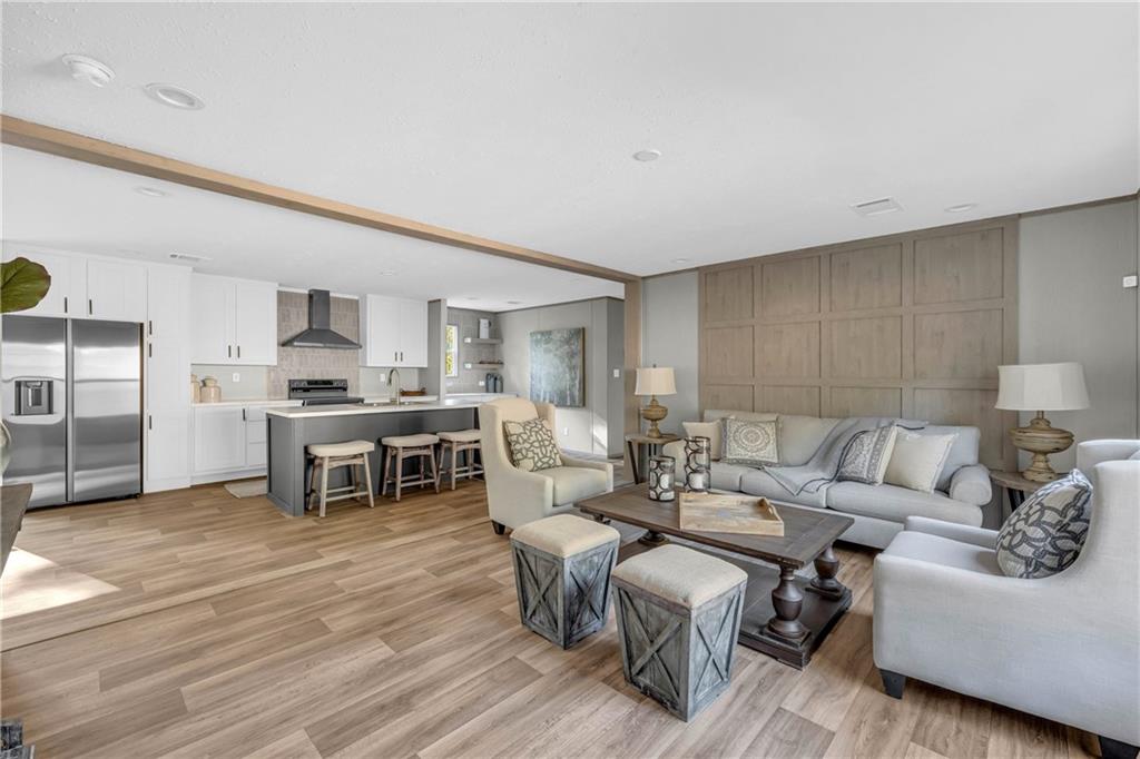 946 Essic Road Ball Ground, GA 30107 - Photo 4 of 45 a living room with furniture and kitchen view