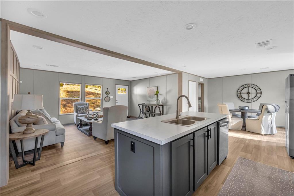 946 Essic Road Ball Ground, GA 30107 - Photo 10 of 45 a living room with furniture a table and large windows