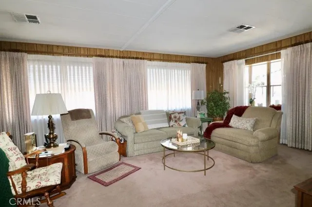 a kitchen with a sink refrigerator and cabinets