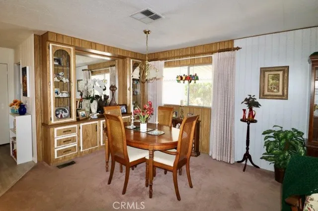 a kitchen with kitchen island granite countertop a sink cabinets and stainless steel appliances