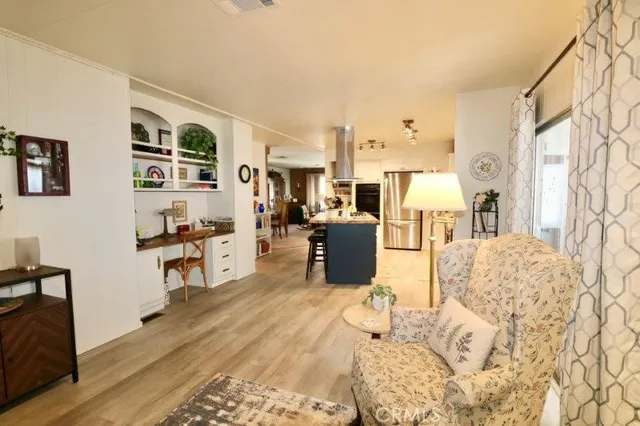 a living room with a couch and a stove top oven