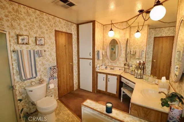 a bedroom with bed and a window