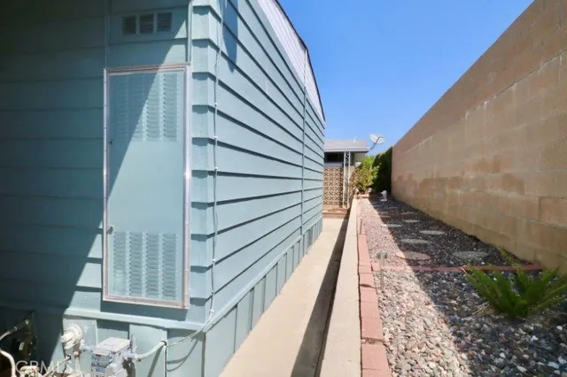 a view of a patio with a table and chairs and potted plants