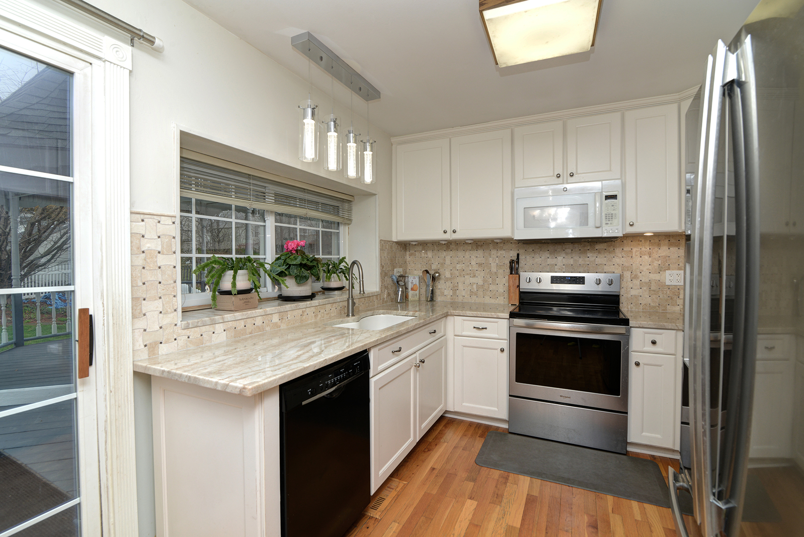 794 Burning Trail Carol Stream, IL 60188 - Photo 11 of 35 a kitchen with stainless steel appliances granite countertop a stove a sink and a refrigerator