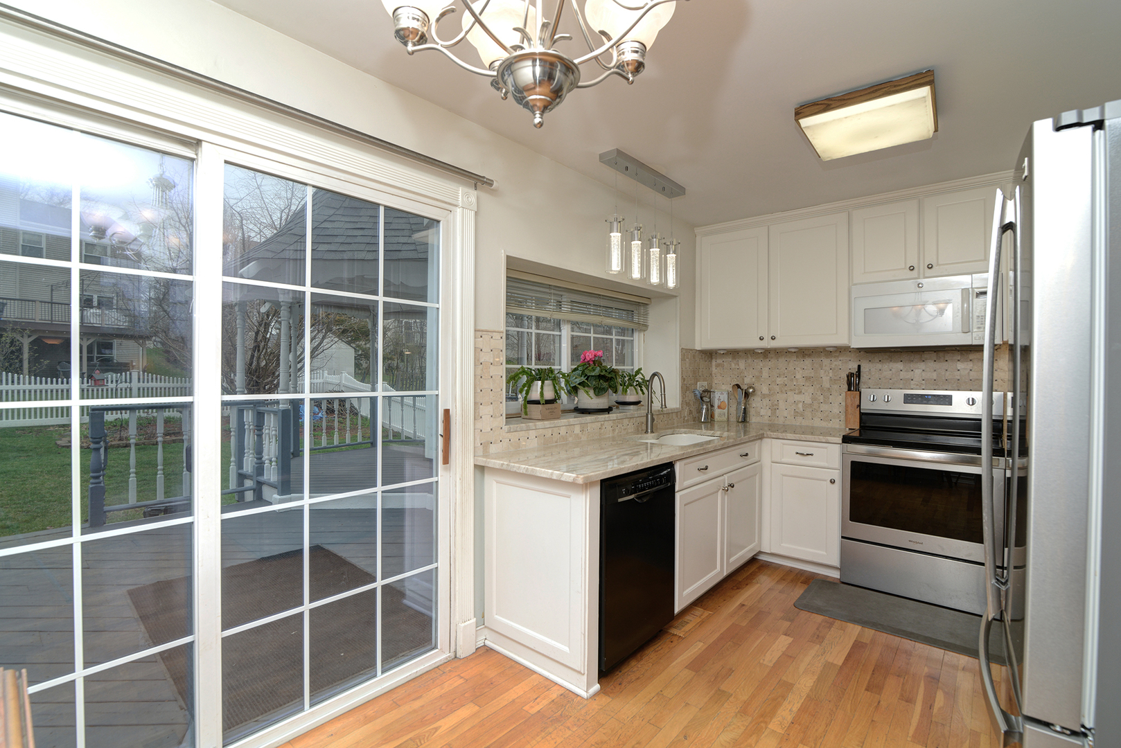 794 Burning Trail Carol Stream, IL 60188 - Photo 12 of 35 a kitchen with stainless steel appliances granite countertop a stove and a refrigerator