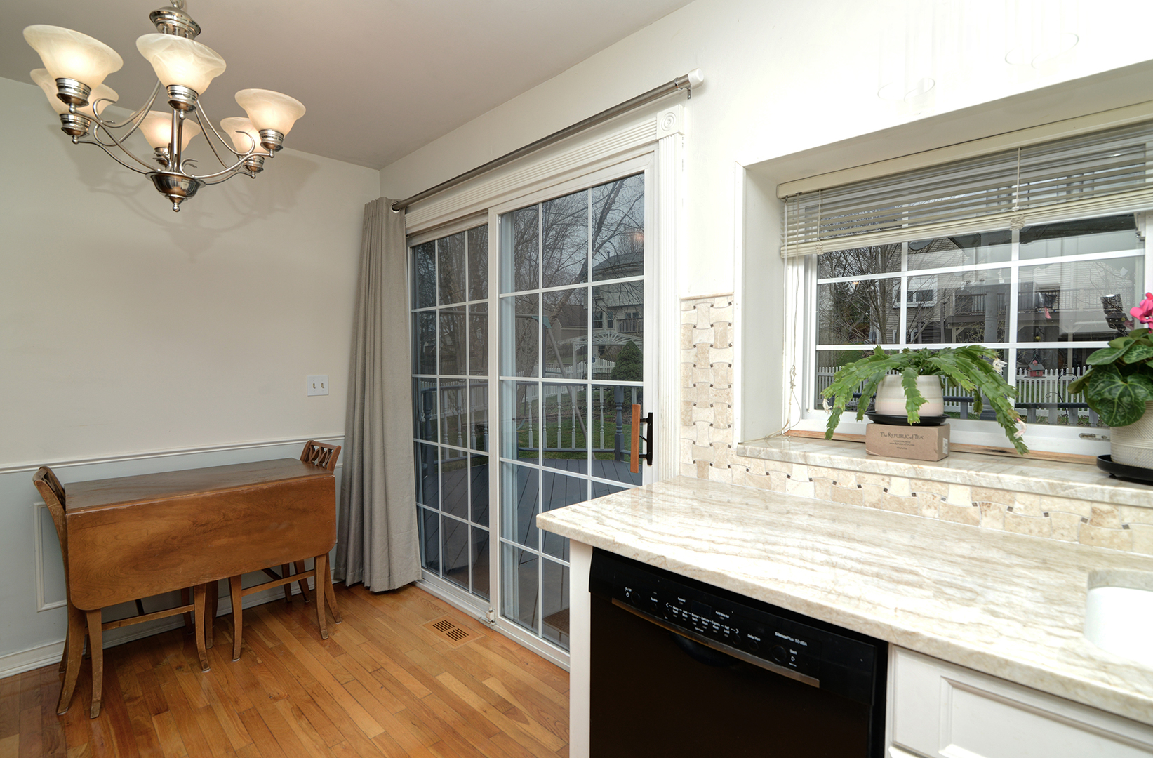 794 Burning Trail Carol Stream, IL 60188 - Photo 14 of 35 a view of a room that has a couch and a dining table in it