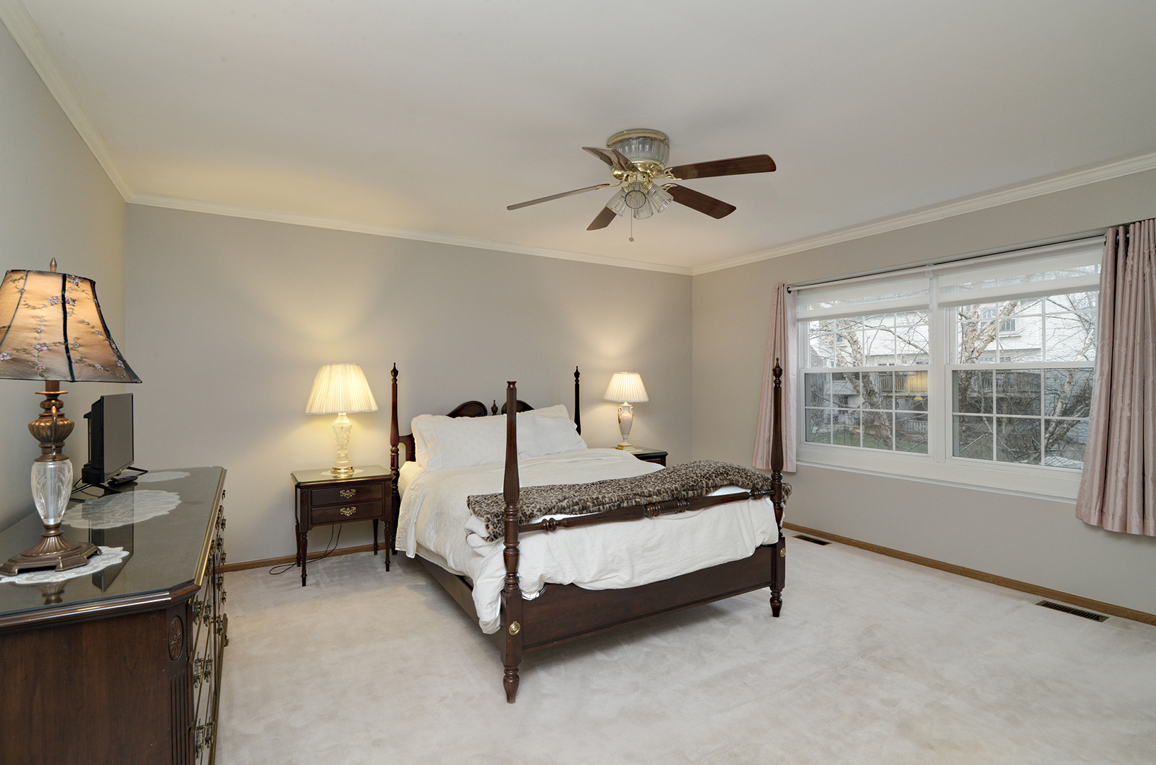 794 Burning Trail Carol Stream, IL 60188 - Photo 20 of 35 a bedroom with a bed a chandelier and a window