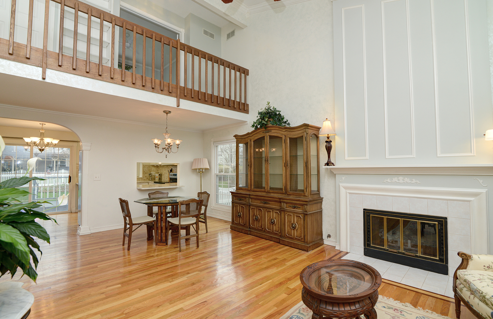 794 Burning Trail Carol Stream, IL 60188 - Photo 7 of 35 a living room with furniture a fireplace and a potted plant