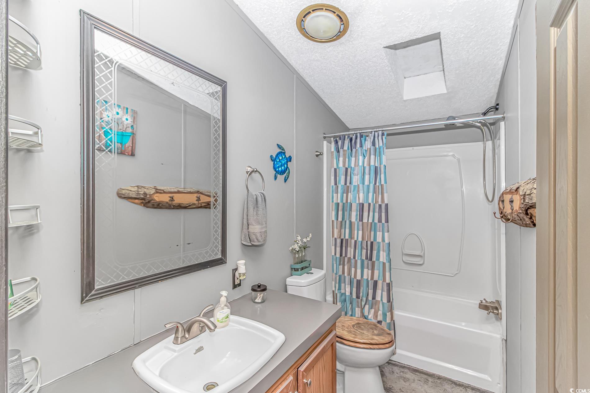 2128 West Homewood Road Conway, SC 29526 - Photo 17 of 32 Full bathroom featuring vanity, shower / tub combo