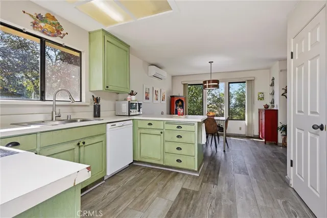 a spacious bathroom with a double vanity sink a mirror and next to a window