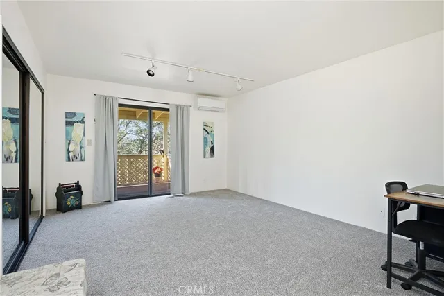 a view of a livingroom with a workspace