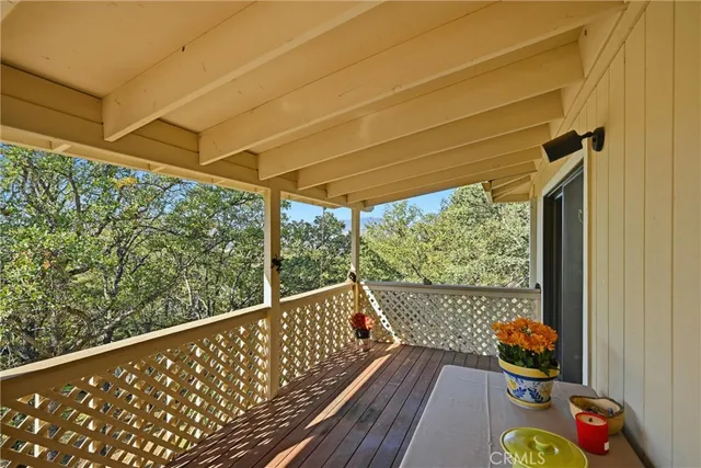 a view of a chair and table in the balcony