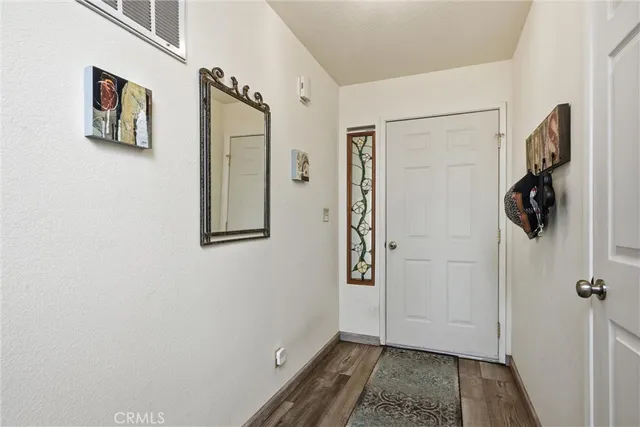 a view of a hallway with front door