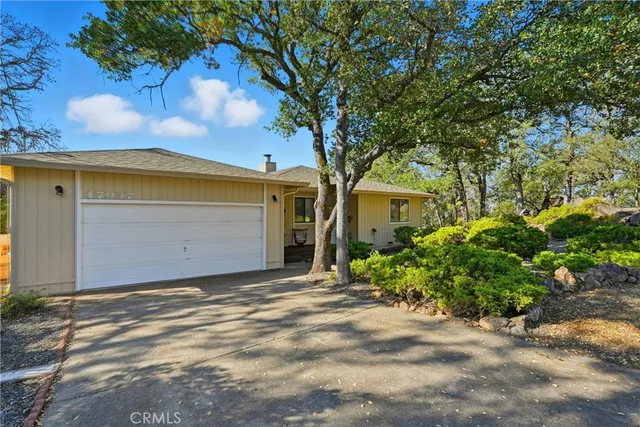 a view of a house with a tree