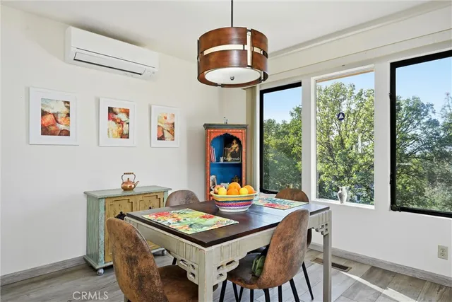 a view of a dining room with furniture window and outside view