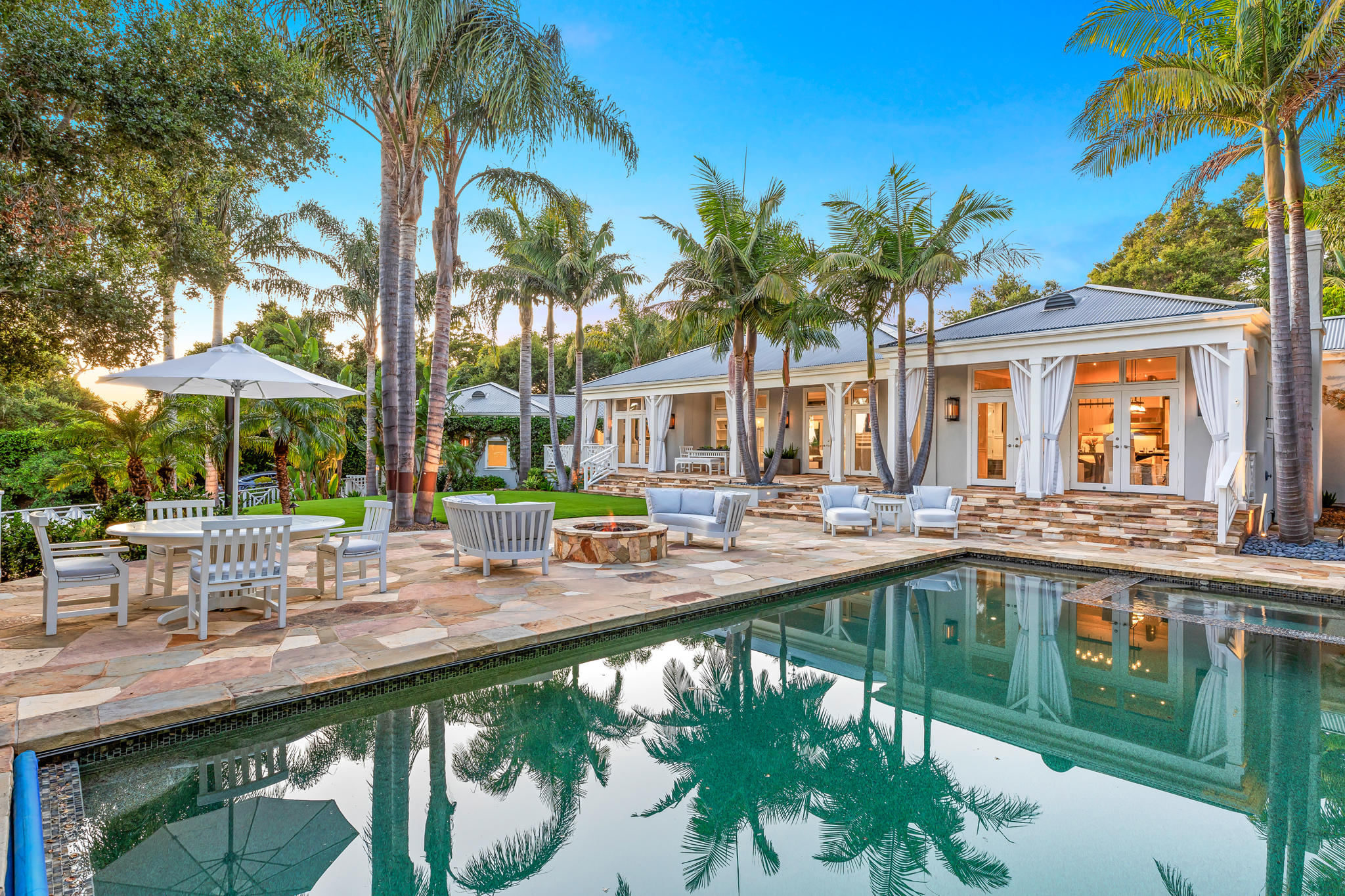 808 Riven Rock Road Santa Barbara, CA 93108 - Photo 1 of 44 a front view of a house with swimming pool and patio