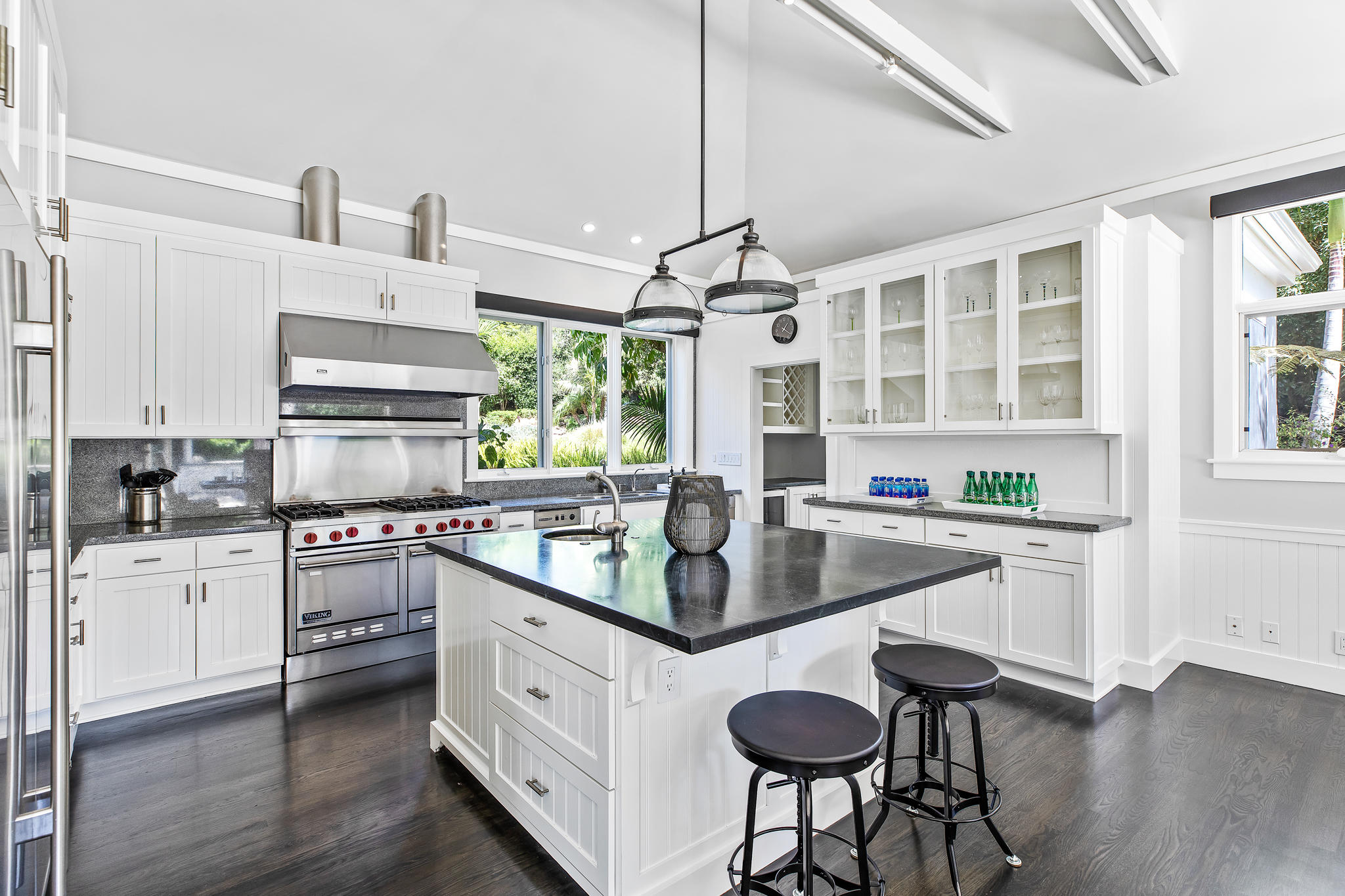 808 Riven Rock Road Santa Barbara, CA 93108 - Photo 12 of 44 a kitchen with stainless steel appliances granite countertop white cabinets a stove a sink and a wooden floors