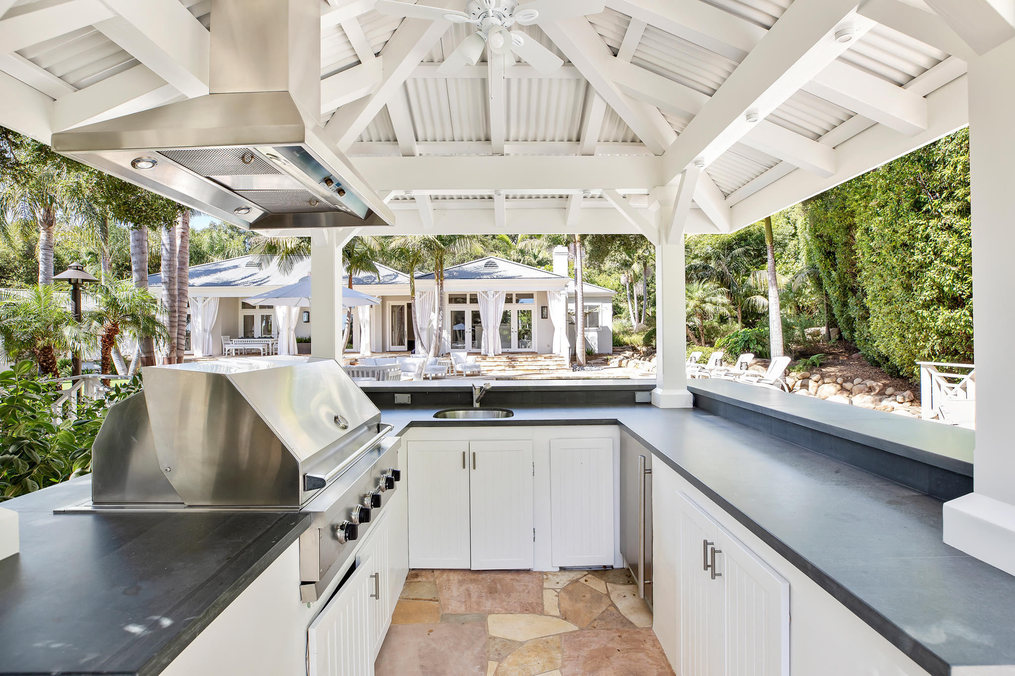 808 Riven Rock Road Santa Barbara, CA 93108 - Photo 26 of 44 a kitchen with stainless steel appliances granite countertop a sink and a large window