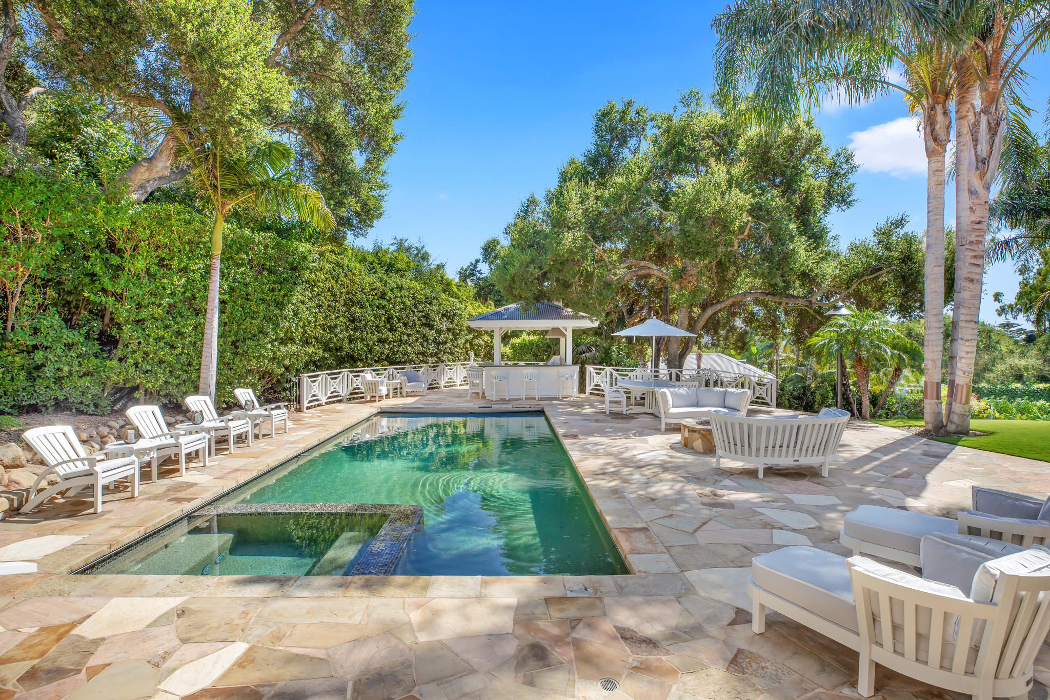 808 Riven Rock Road Santa Barbara, CA 93108 - Photo 27 of 44 a view of a swimming pool with a patio and backyard