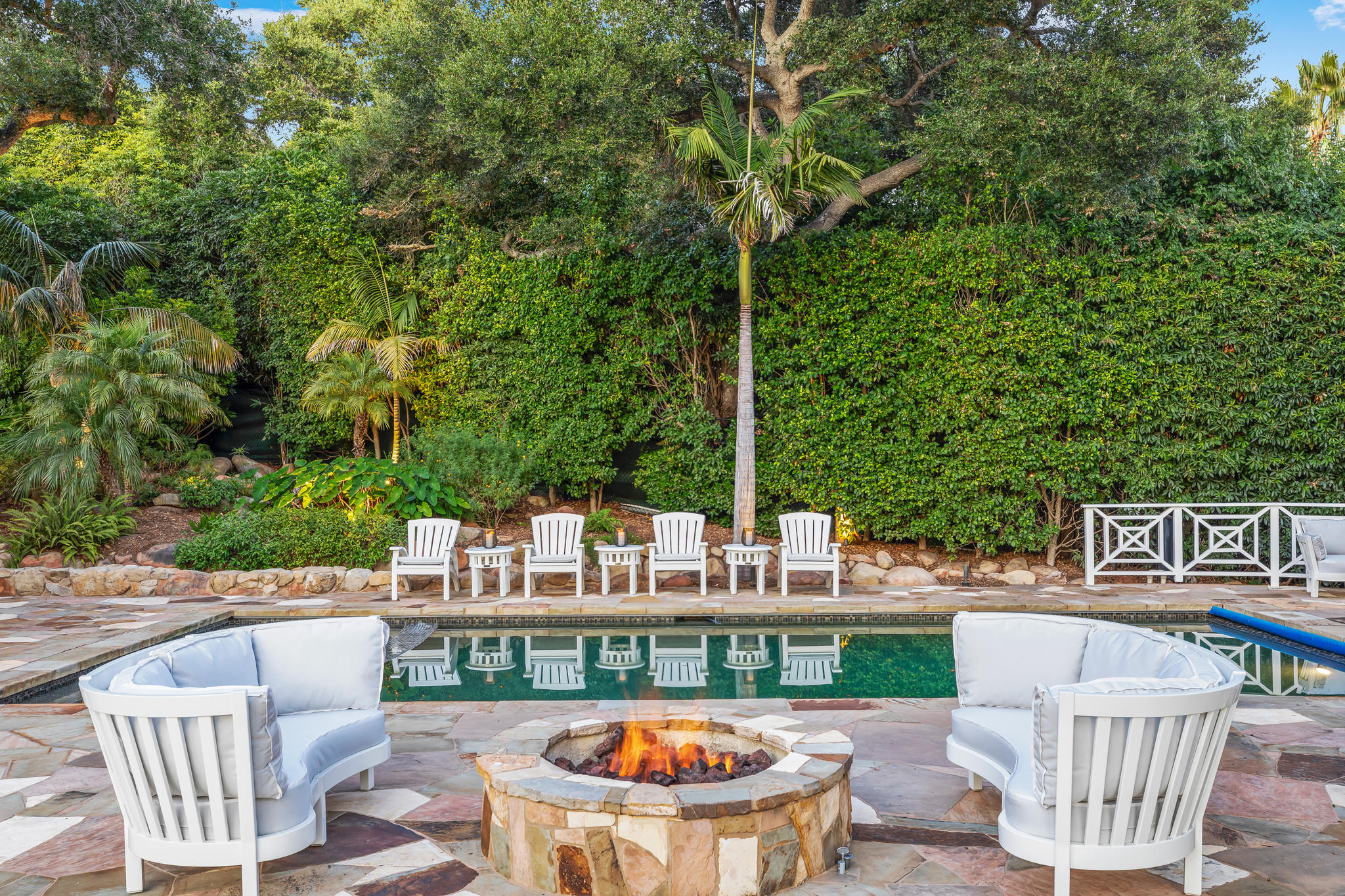 808 Riven Rock Road Santa Barbara, CA 93108 - Photo 28 of 44 a view of a patio with couches table and chairs and potted plants