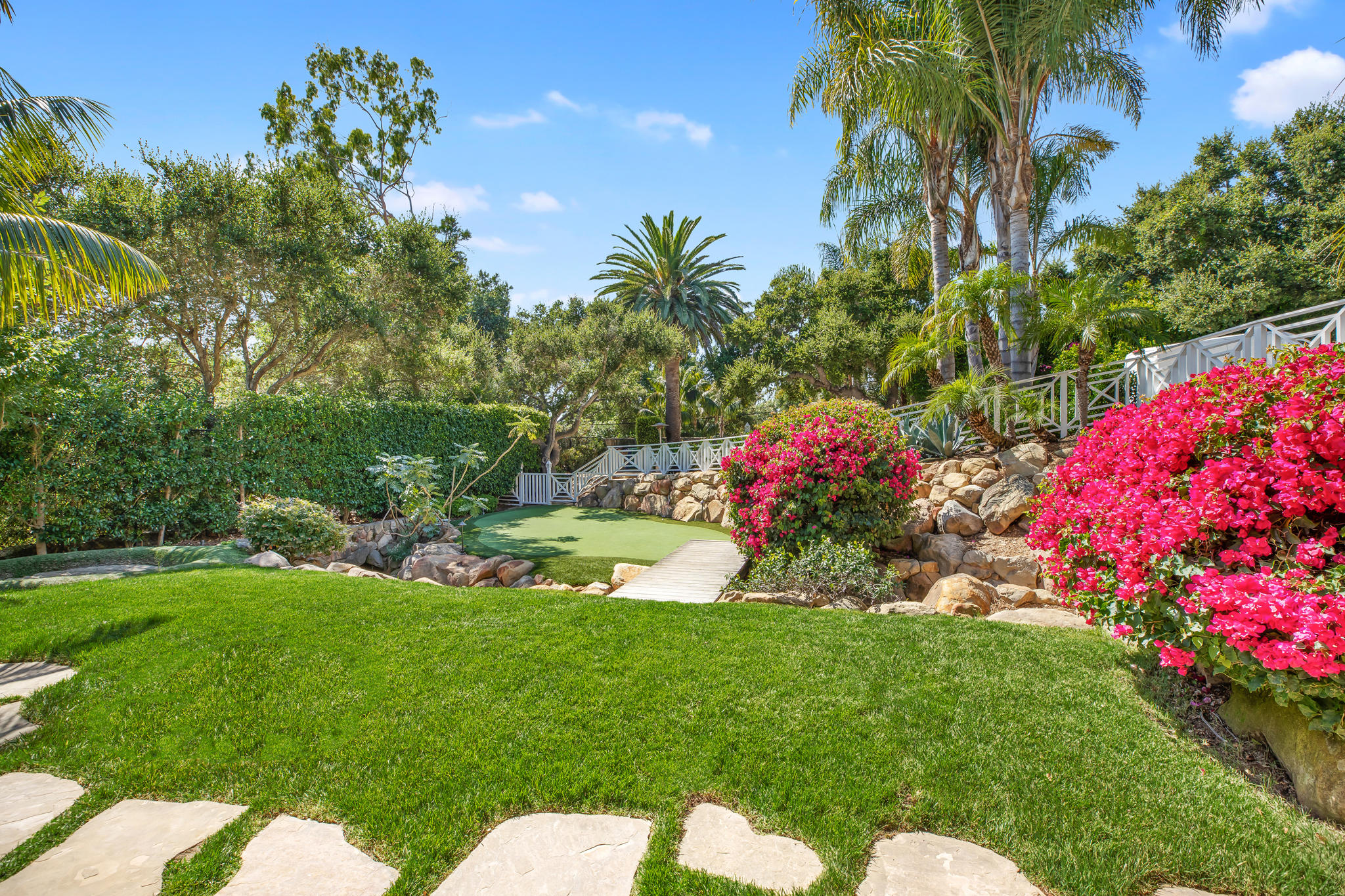 808 Riven Rock Road Santa Barbara, CA 93108 - Photo 33 of 44 a view of a garden with plants and palm trees