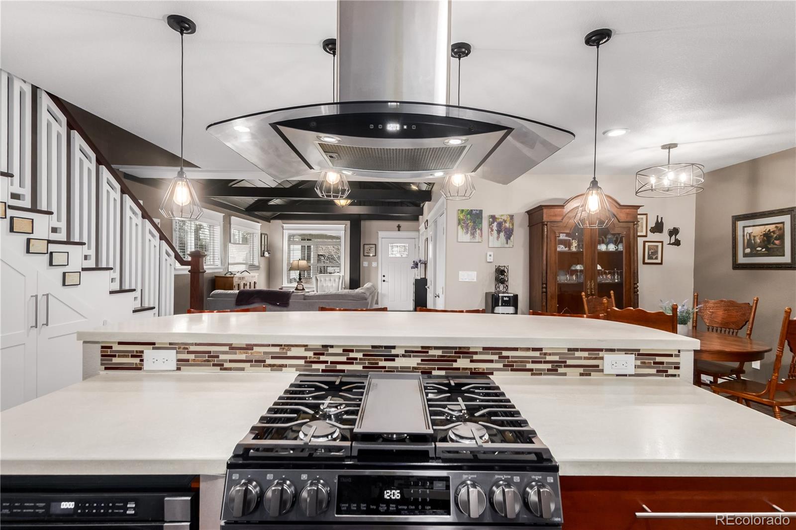 10640 West 46th Avenue Wheat Ridge, CO 80033 - Photo 12 of 46 a stove top oven sitting inside of a kitchen