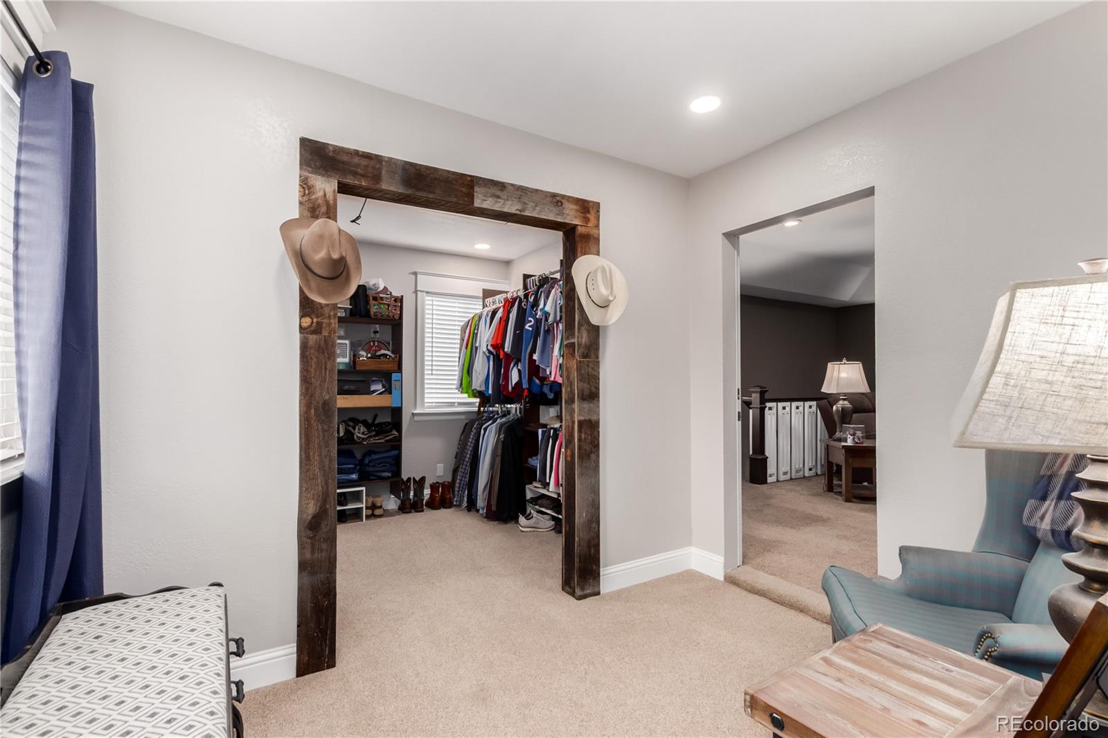 10640 West 46th Avenue Wheat Ridge, CO 80033 - Photo 15 of 46 a view of walk in closet with clothes and shoes