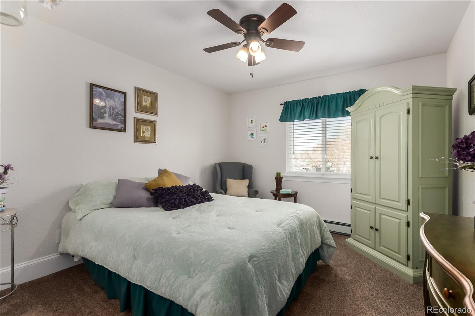 10640 West 46th Avenue Wheat Ridge, CO 80033 - Photo 24 of 46 a bedroom with a bed and window