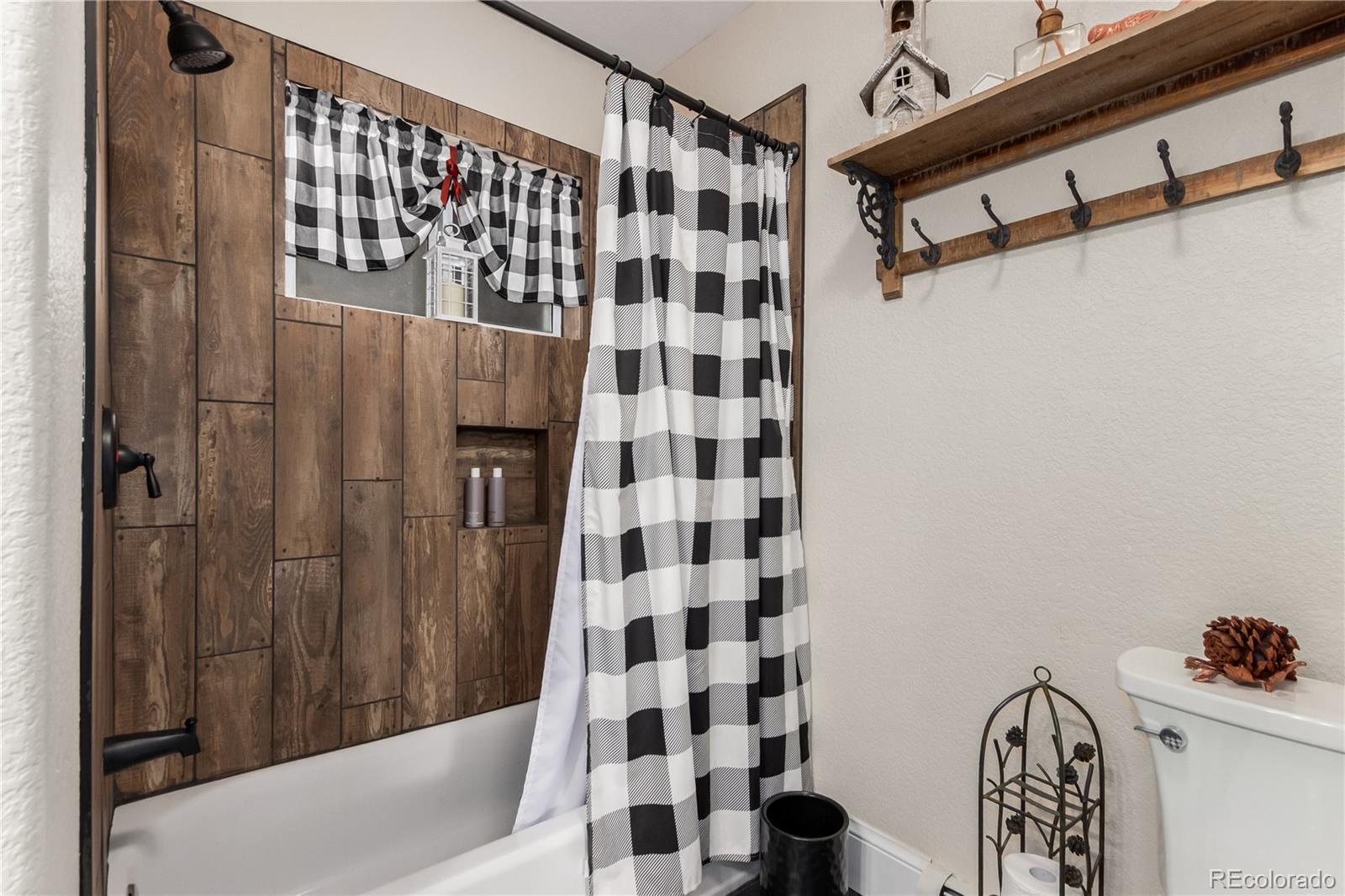 10640 West 46th Avenue Wheat Ridge, CO 80033 - Photo 27 of 46 a bathroom with a shower and a sink