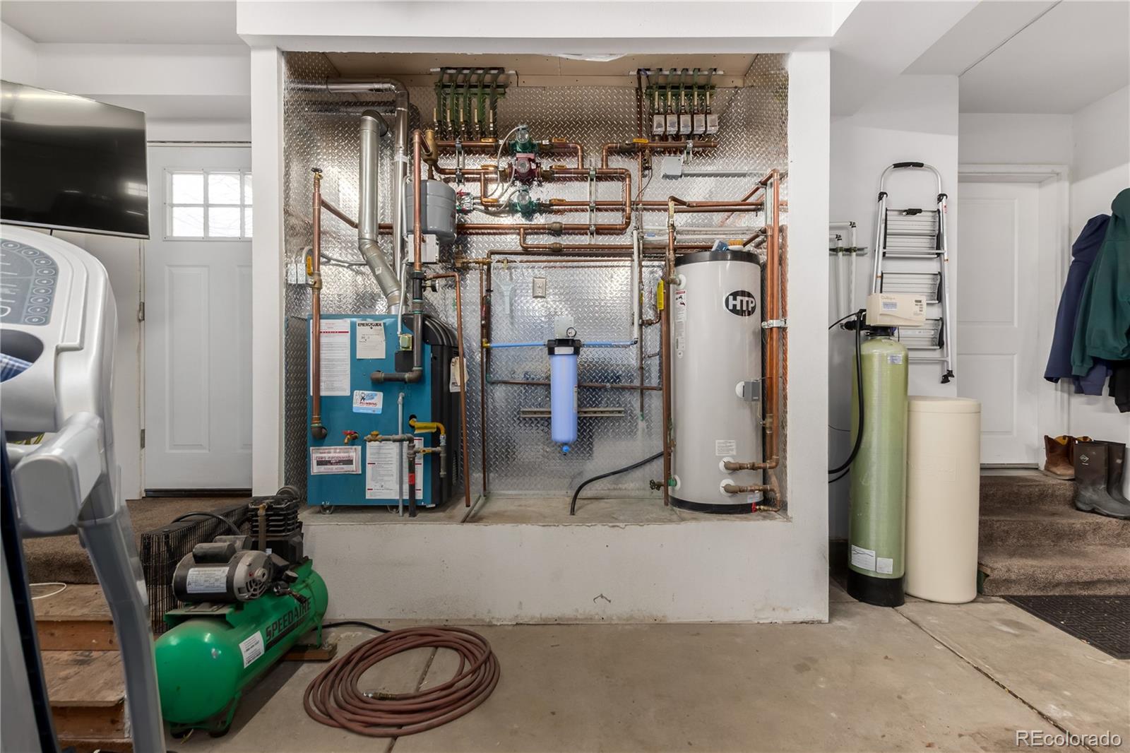 10640 West 46th Avenue Wheat Ridge, CO 80033 - Photo 29 of 46 a room with lots of white furniture and a view of bedroom