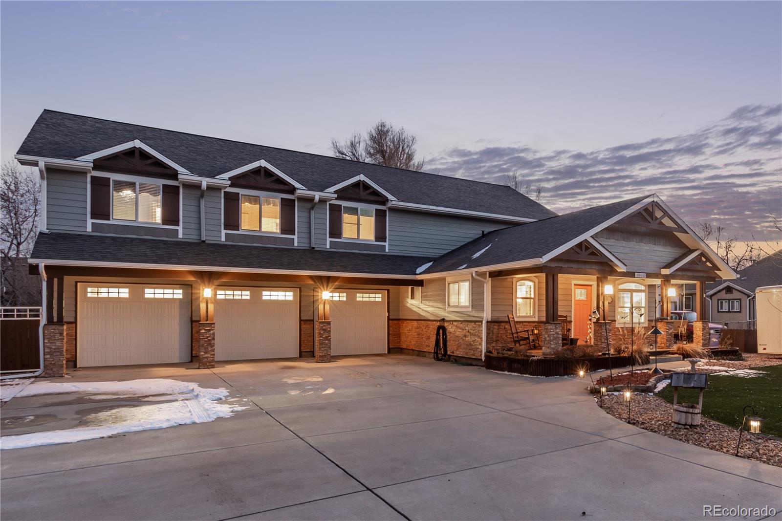 10640 West 46th Avenue Wheat Ridge, CO 80033 - Photo 3 of 46 a front view of a house with a yard and garage