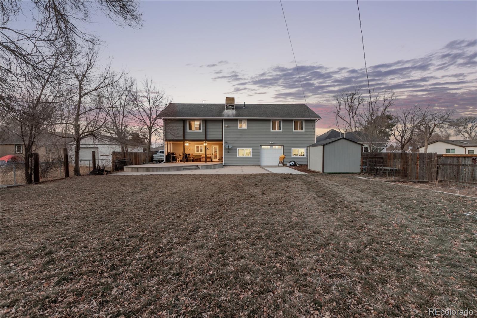 10640 West 46th Avenue Wheat Ridge, CO 80033 - Photo 31 of 46 a view of a house with a yard