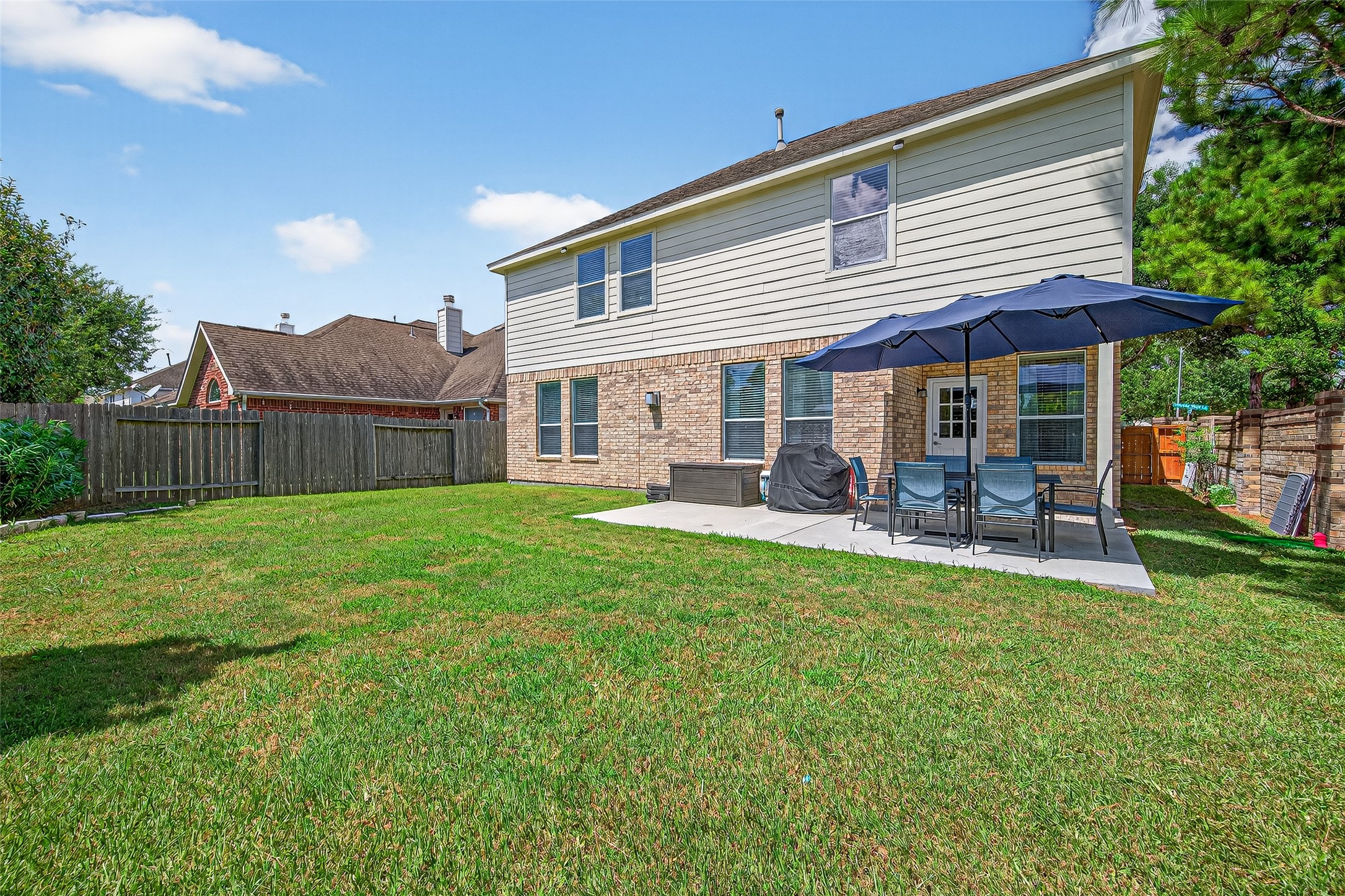 6230 Hollydale Ridge Lane Katy, TX 77494 - Photo 37 of 41 a view of a house with a backyard and patio