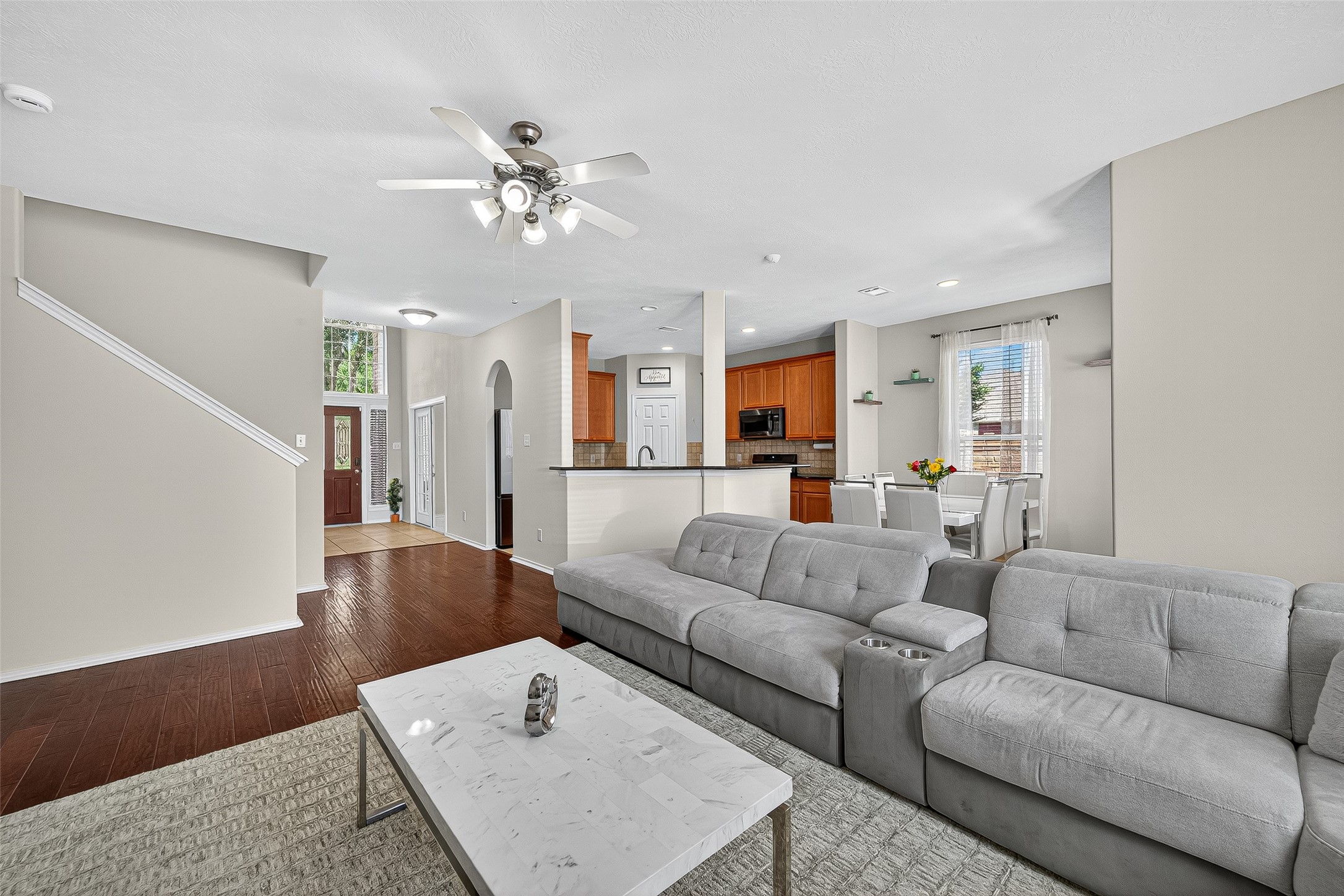6230 Hollydale Ridge Lane Katy, TX 77494 - Photo 7 of 41 a living room with furniture and a chandelier