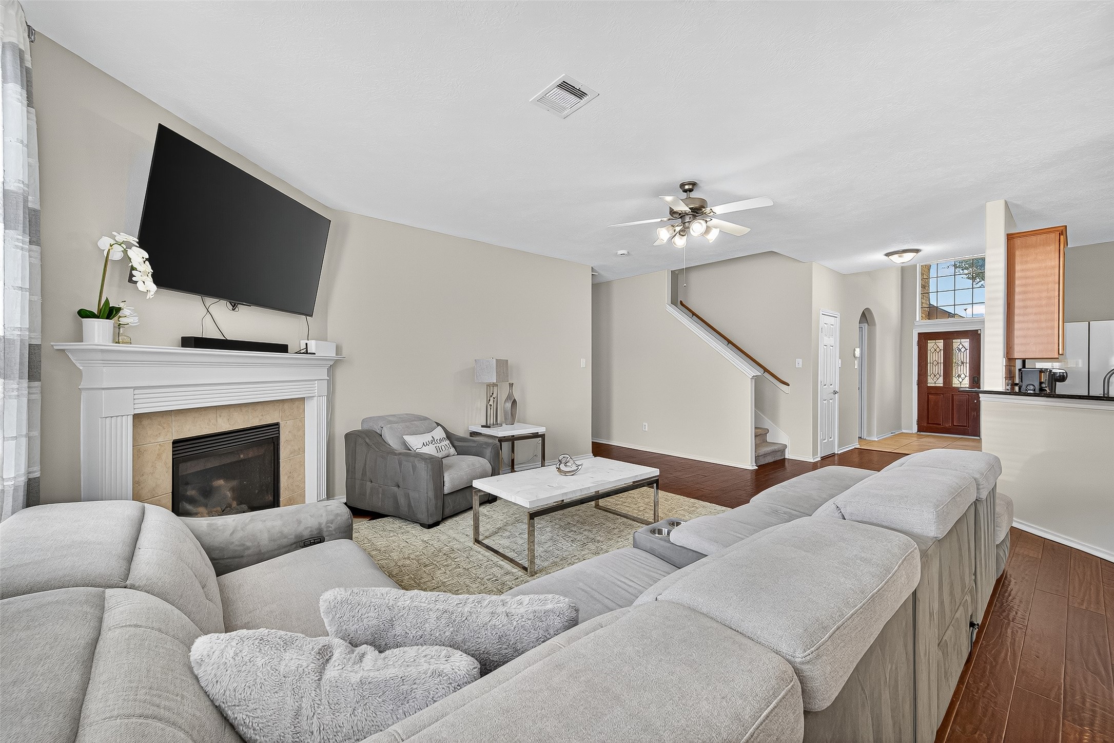 6230 Hollydale Ridge Lane Katy, TX 77494 - Photo 8 of 41 a living room with furniture fireplace and flat screen tv