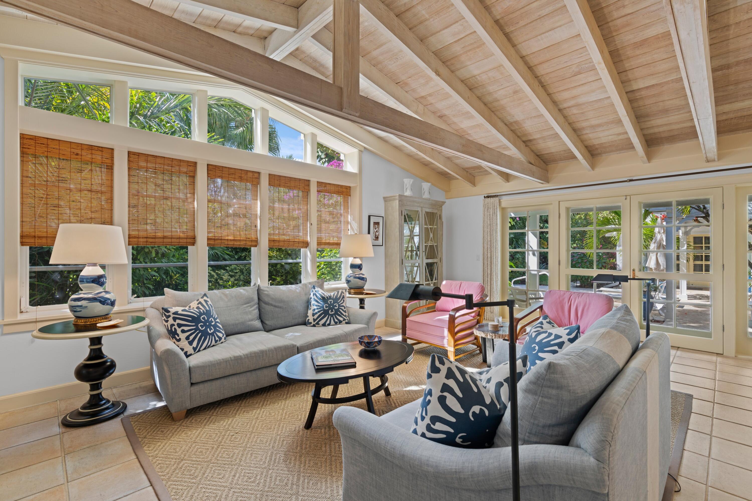 240 Celestial Way, Unit 10 Juno Beach, FL 33408 - Photo 13 of 40 a living room with furniture and a large window