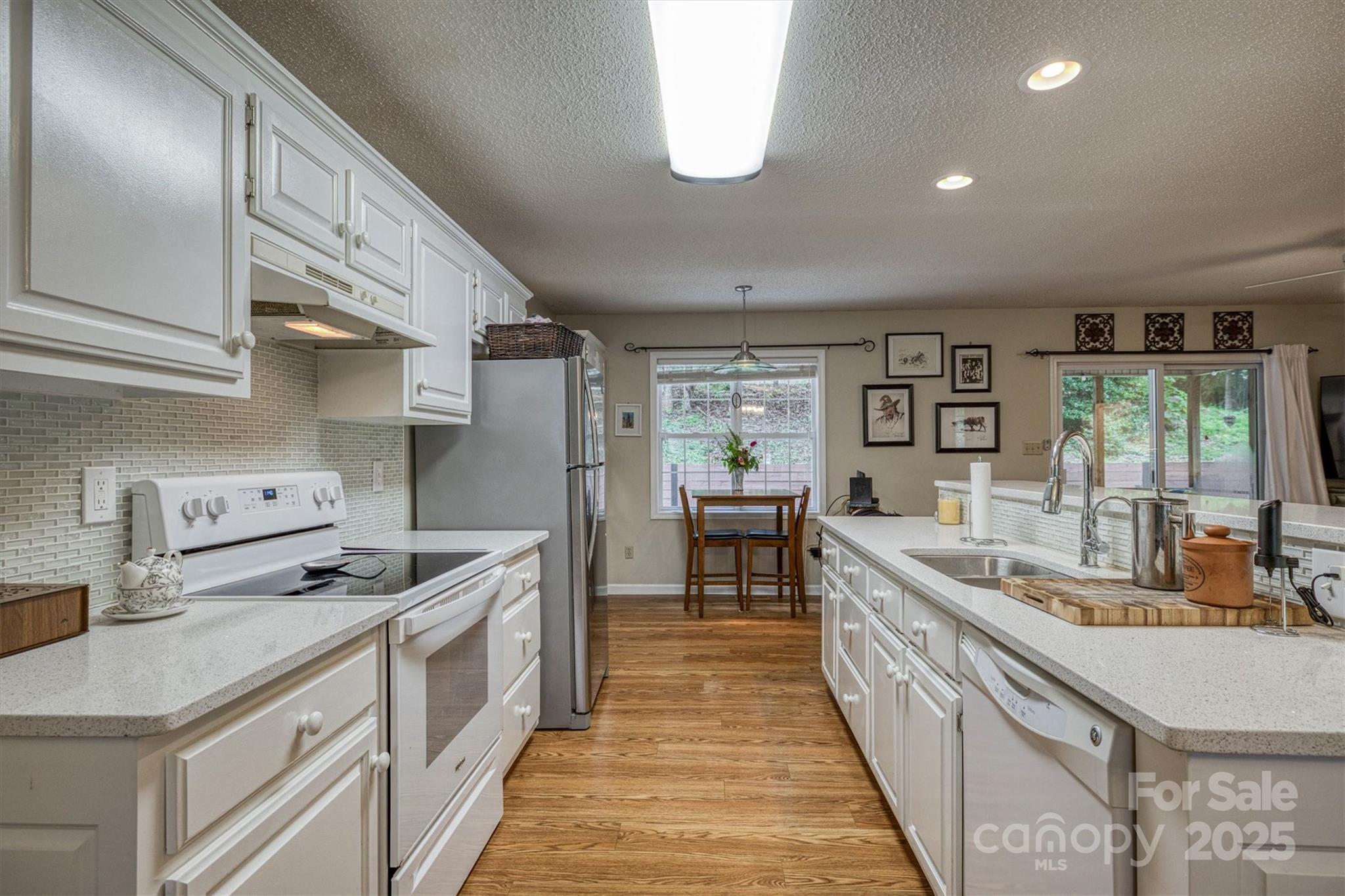 187 Yancey Road Marion, NC 28752 - Photo 18 of 36 a kitchen with stainless steel appliances granite countertop a sink and a stove