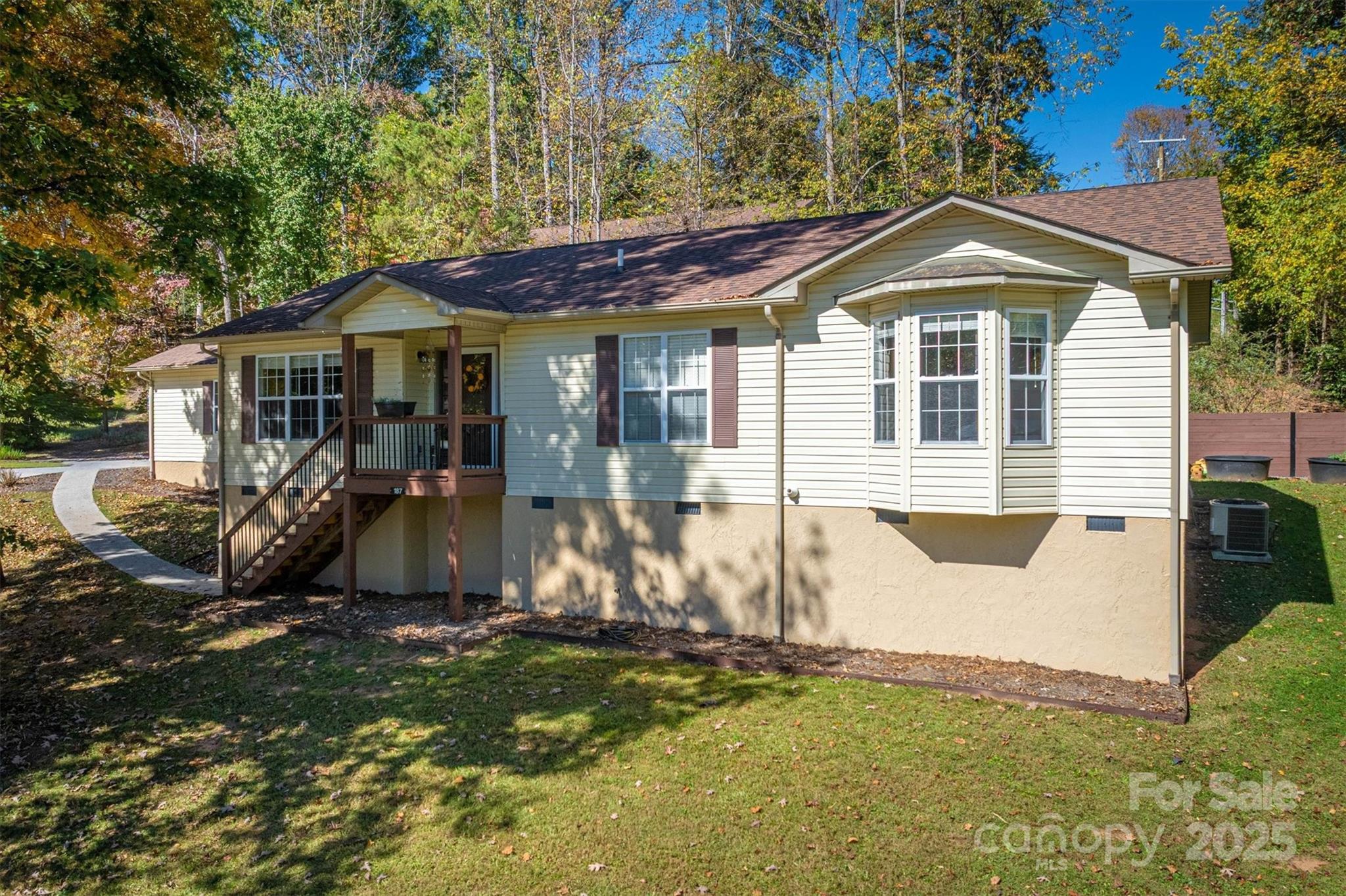 187 Yancey Road Marion, NC 28752 - Photo 3 of 36 a front view of a house with a yard