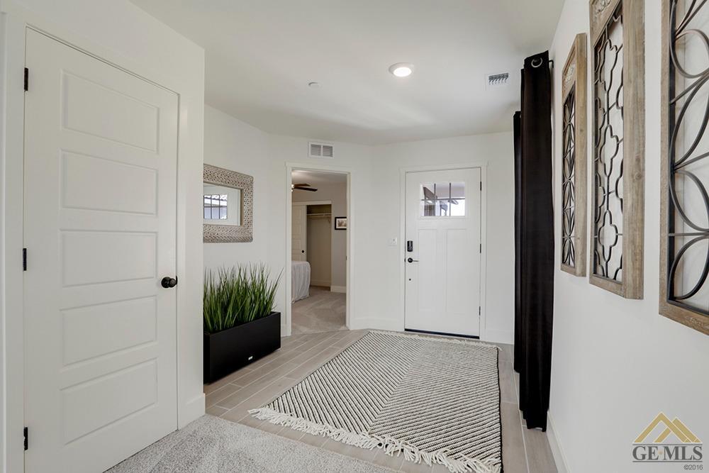 Undisclosed Address Bakersfield, CA 93311 - Photo 28 of 28 a view of a hallway with paintings on the wall