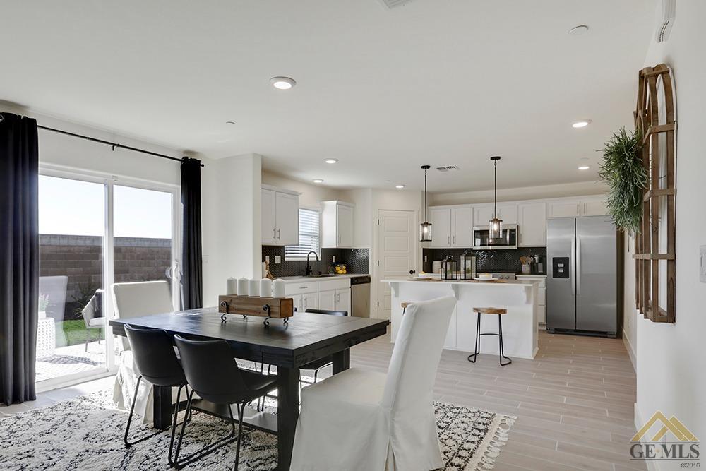 Undisclosed Address Bakersfield, CA 93311 - Photo 4 of 28 a view of a dining room with furniture window and wooden floor