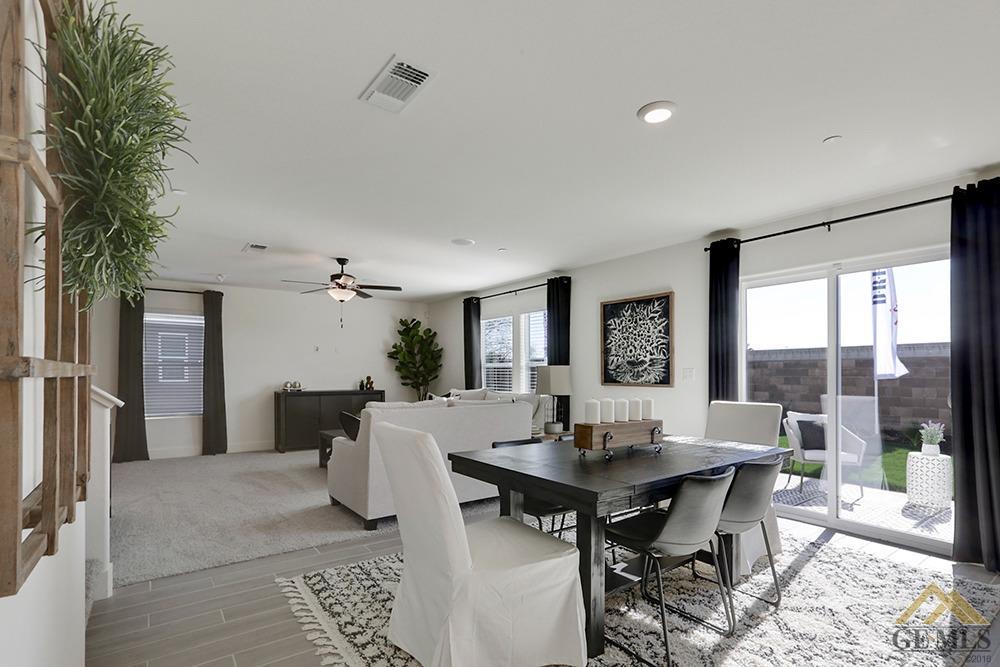 Undisclosed Address Bakersfield, CA 93311 - Photo 6 of 28 a view of a dining room with furniture window and wooden floor