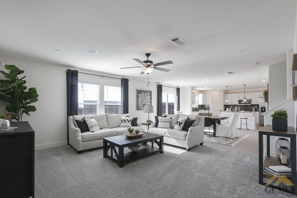 Undisclosed Address Bakersfield, CA 93311 - Photo 7 of 28 a living room with furniture and a large window