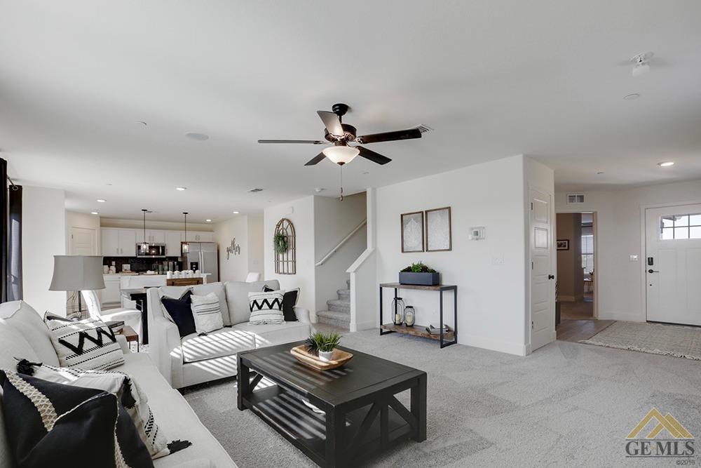 Undisclosed Address Bakersfield, CA 93311 - Photo 9 of 28 a living room with furniture and kitchen view