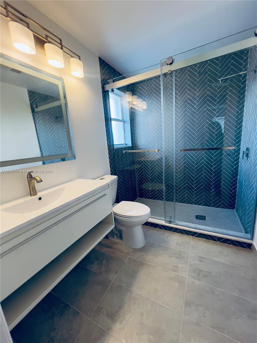 a bathroom with a bathtub toilet and sink