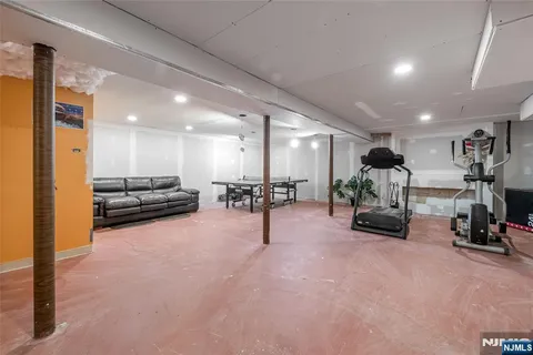 a living room with furniture and a table with wooden floor