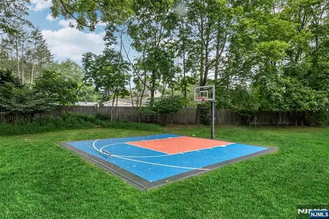 a view of pool with patio and yard