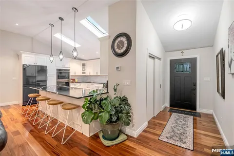 a view of a hallway with washer and dryer