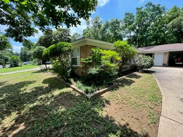 a kitchen with a refrigerator a stove a washer and dryer